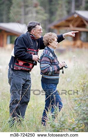 Couple bird watching, Lone Mt Ranch, Big Sky, Montana, USA View Large Photo Image Stock Image - Couple bird watching, Lone Mt Ranch, Big Sky, Montana, USA. Fotosearch