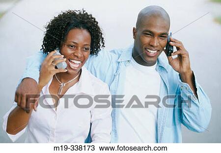 couple both on cellulars View Large Photo Image Stock Image - couple both on cellulars. Fotosearch