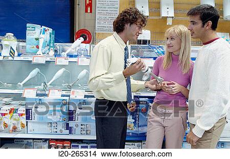 Couple buying a hand blender at shopping center View Large Photo Image Picture - Couple buying a hand blender at shopping center. Fotosearch
