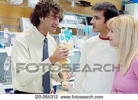 Couple buying a hand blender at shopping center View Large Photo Image Stock Image - Couple buying a hand blender at shopping center. Fotosearch