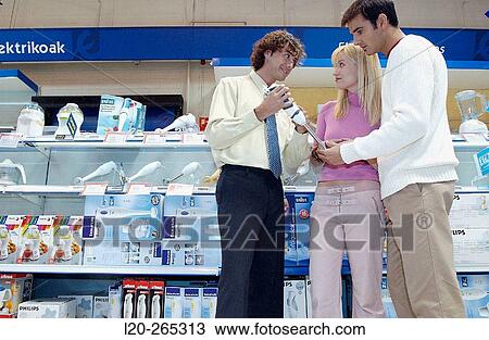 Couple buying a hand blender at shopping center View Large Photo Image Stock Image - Couple buying a hand blender at shopping center. Fotosearch
