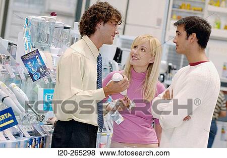 Couple buying a hand blender at shopping center View Large Photo Image Stock Photo - Couple buying a hand blender at shopping center. Fotosearch