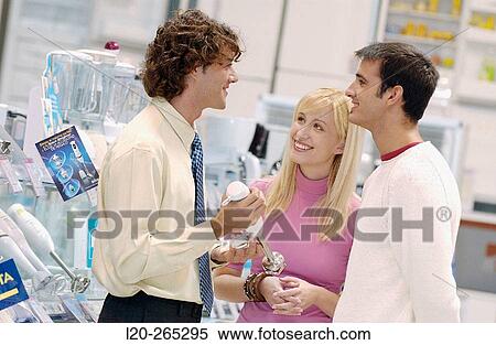 Couple buying a hand blender at shopping center View Large Photo Image Stock Photography - Couple buying a hand blender at shopping center. Fotosearch