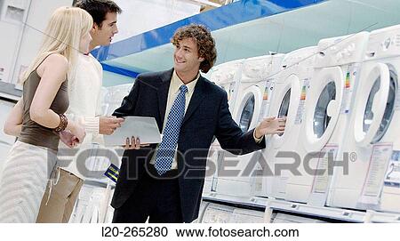Couple buying a washing machine View Large Photo Image Stock Image - Couple buying a washing machine. Fotosearch