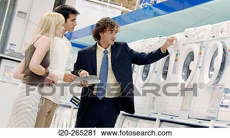 Couple buying a washing machine View Large Photo Image Stock Image - Couple buying a washing machine. Fotosearch