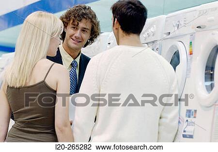 Couple buying a washing machine View Large Photo Image Stock Image - Couple buying a washing machine. Fotosearch