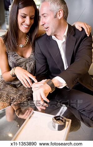 Stock Image - Couple buying a wristwatch. Fotosearch