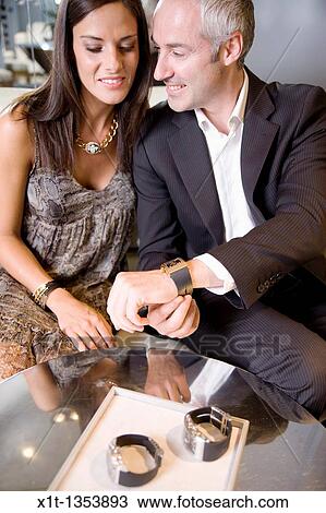 Stock Image - Couple buying a wristwatch. Fotosearch