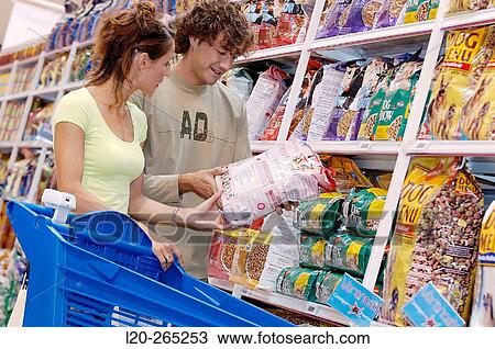 Couple buying dog food at shopping center View Large Photo Image Stock Image - Couple buying dog food at shopping center. Fotosearch