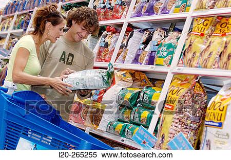 Couple buying dog food at shopping center View Large Photo Image Stock Photography - Couple buying dog food at shopping center. Fotosearch