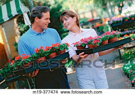 Picture - couple buying flowers for the garden. Fotosearch