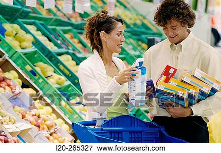 Couple buying food View Large Photo Image Stock Photo - Couple buying food. Fotosearch