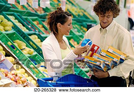 Couple buying food View Large Photo Image Stock Photo - Couple buying food. Fotosearch