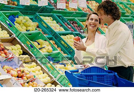 Couple buying fruit View Large Photo Image Picture - Couple buying fruit. Fotosearch