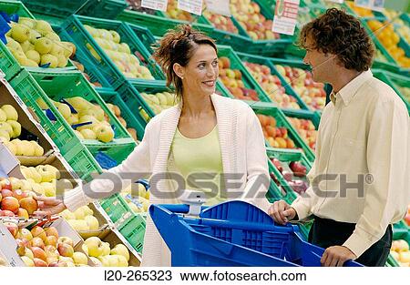 Couple buying fruit View Large Photo Image Stock Image - Couple buying fruit. Fotosearch