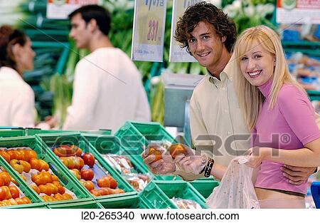 Couple buying fruit View Large Photo Image Stock Image - Couple buying fruit. Fotosearch
