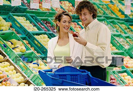 Couple buying fruit View Large Photo Image Stock Photography - Couple buying fruit. Fotosearch