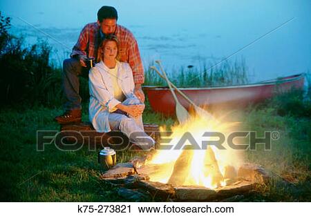 Couple by campfire View Large Photo Image Stock Image - Couple by campfire. Fotosearch