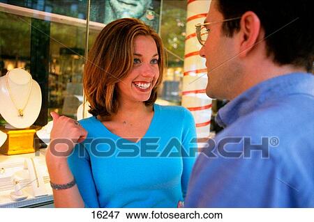 Stock Photo - Couple by jewelry shop. Fotosearch