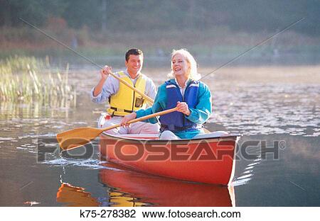 couple canoeing in Poconos View Large Photo Image Stock Image - couple canoeing in Poconos. Fotosearch