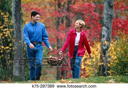couple carrying basket of apples View Large Photo Image Stock Photo - couple carrying basket of apples. Fotosearch