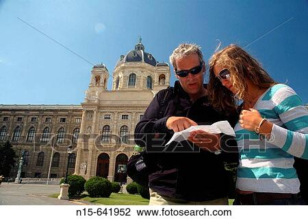 Stock Image - Couple checking the map outside the Kunsthistorische Museum (Art History Museum), Vienna, Austria.. Fotosearch