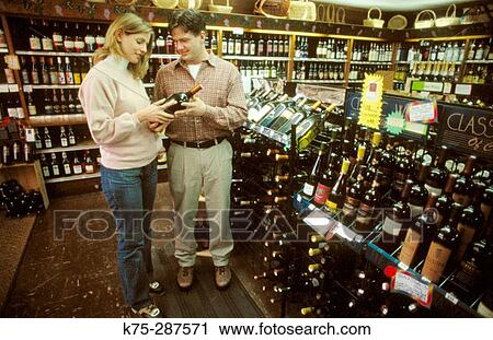 couple choosing a wine View Large Photo Image Stock Image - couple choosing a wine. Fotosearch