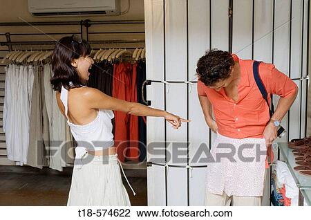 couple choosing clothes at store View Large Photo Image Stock Image - couple choosing clothes at store. Fotosearch