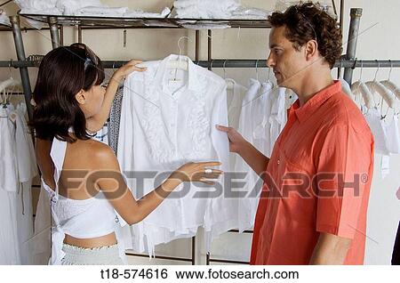 couple choosing clothes at store View Large Photo Image Stock Photograph - couple choosing clothes at store. Fotosearch