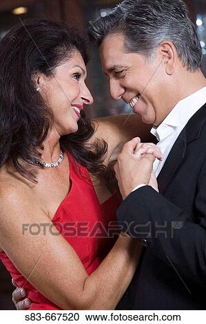Couple dancing indoors View Large Photo Image Stock Image - Couple dancing indoors. Fotosearch