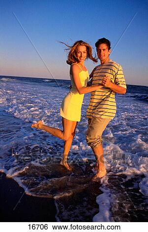 Couple dancing on a beach View Large Photo Image Stock Photograph - Couple dancing on a beach. Fotosearch