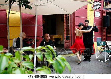 Couple dancing tango at La Boca district Buenos Aires, Argentina View Large Photo Image Stock Photo - Couple dancing tango at La Boca district Buenos Aires, Argentina. Fotosearch