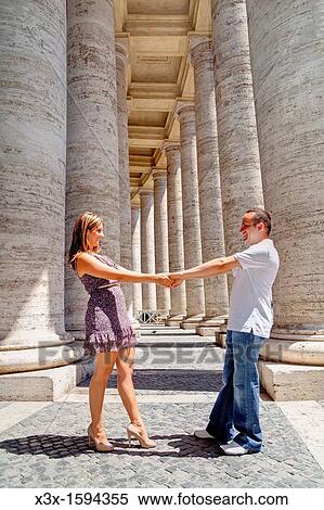 Couple dancing underneath the columns of Saint Peter's square Vatican Rome Italy View Large Photo Image Stock Photography - Couple dancing underneath the columns of Saint Peter's square Vatican Rome Italy. Fotosearch