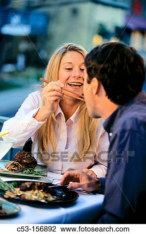 Couple dining outside View Large Photo Image Stock Image - Couple dining outside. Fotosearch