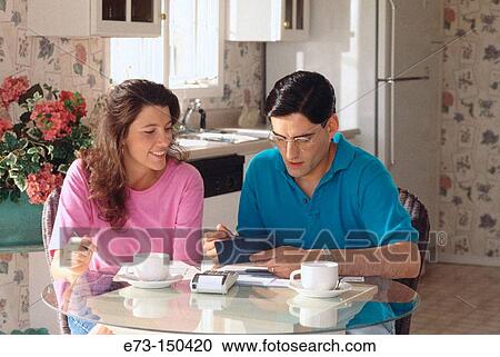 Couple doing home finances View Large Photo Image Stock Image - Couple doing home finances. Fotosearch