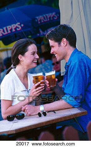 Couple drinking beer View Large Photo Image Stock Photo - Couple drinking beer. Fotosearch