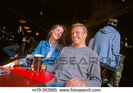 Stock Photography - Couple drinking beer. Fotosearch