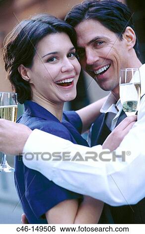 Couple drinking champagne View Large Photo Image Stock Photograph - Couple drinking champagne. Fotosearch