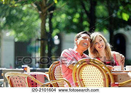 Couple drinking coffee on a terrace. San Sebastian. Donostia. Gipuzkoa. Basque Country. Spain. View Large Photo Image Picture - Couple drinking coffee on a terrace. San Sebastian. Donostia. Gipuzkoa. Basque Country. Spain.. Fotosearch