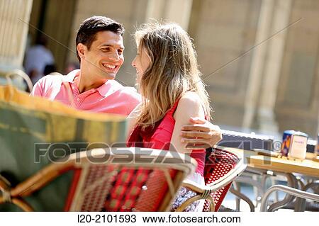 Stock Image - Couple drinking coffee on a terrace. San Sebastian. Donostia. Gipuzkoa. Basque Country. Spain.. Fotosearch