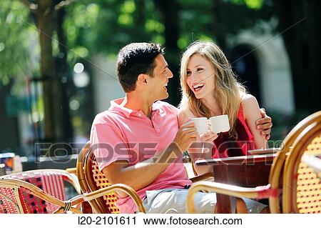 Stock Image - Couple drinking coffee on a terrace. San Sebastian. Donostia. Gipuzkoa. Basque Country. Spain.. Fotosearch