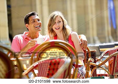 Couple drinking coffee on a terrace. San Sebastian. Donostia. Gipuzkoa. Basque Country. Spain. View Large Photo Image Stock Photo - Couple drinking coffee on a terrace. San Sebastian. Donostia. Gipuzkoa. Basque Country. Spain.. Fotosearch