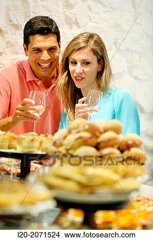 Couple drinking wine and eating tapas. Pintxos. Bar txondorra. Parte Vieja. Old town. San Sebastian. Donostia. Gipuzkoa. Basque Country. Spain. View Large Photo Image Picture - Couple drinking wine and eating tapas. Pintxos. Bar txondorra. Parte Vieja. Old town. San Sebastian. Donostia. Gipuzkoa. Basque Country. Spain.. Fotosearch