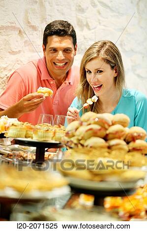 Couple drinking wine and eating tapas. Pintxos. Bar txondorra. Parte Vieja. Old town. San Sebastian. Donostia. Gipuzkoa. Basque Country. Spain. View Large Photo Image Stock Photography - Couple drinking wine and eating tapas. Pintxos. Bar txondorra. Parte Vieja. Old town. San Sebastian. Donostia. Gipuzkoa. Basque Country. Spain.. Fotosearch