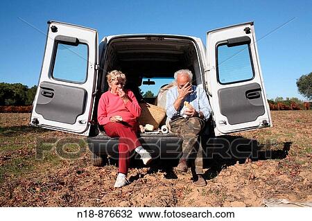 Couple eating at the olive harvest, Mont-ras, Baix Emporda, Girona province, Catalonia, Spain View Large Photo Image Stock Image - Couple eating at the olive harvest, Mont-ras, Baix Emporda, Girona province, Catalonia, Spain. Fotosearch