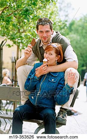 Stock Photograph - Couple eating ice cream. Fotosearch