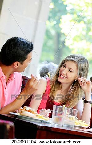 Picture - Couple eating in a restaurant. San Sebastian. Donostia. Gipuzkoa. Basque Country. Spain.. Fotosearch