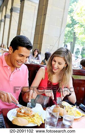 Couple eating in a restaurant. San Sebastian. Donostia. Gipuzkoa. Basque Country. Spain. View Large Photo Image Stock Image - Couple eating in a restaurant. San Sebastian. Donostia. Gipuzkoa. Basque Country. Spain.. Fotosearch