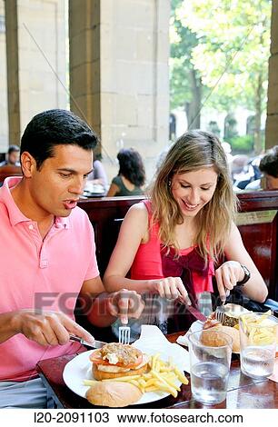 Couple eating in a restaurant. San Sebastian. Donostia. Gipuzkoa. Basque Country. Spain. View Large Photo Image Stock Image - Couple eating in a restaurant. San Sebastian. Donostia. Gipuzkoa. Basque Country. Spain.. Fotosearch