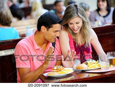 Couple eating in a restaurant. San Sebastian. Donostia. Gipuzkoa. Basque Country. Spain. View Large Photo Image Stock Photo - Couple eating in a restaurant. San Sebastian. Donostia. Gipuzkoa. Basque Country. Spain.. Fotosearch